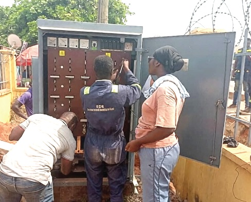 Officials of ECG installing one of the transformers at Nkwawie in the Atwima Nwabiagya South Municipality