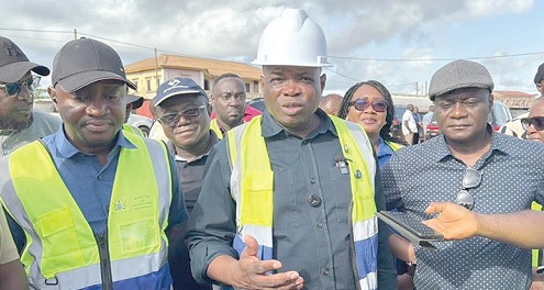 Governs Kwame Agbodza (right), Minister of Roads and Highways, addressing the press after inspecting the Bogoso-Prestea road. With him is Alhassan Suhuyini, his deputy