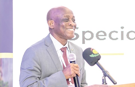 Seth Terkper (inset), Presidential Advisor on the Economy, addressing participants in the forum