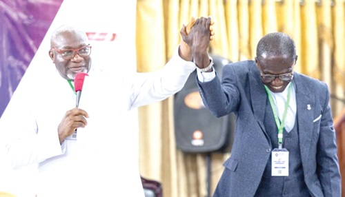 Rev. Enoch Adjei Pobee (left), outgoing Chairman, Ga West Presbytery, PCG, introducing  Rev. David Sowateye Obli, the Chairperson-elect, at the Presbytery Session