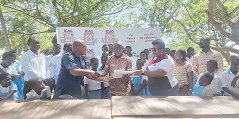 Augustine Addo  (middle), President of ICAG presenting the items to Fred Asare, Managing Director of Village of HopeAugustine Addo  (middle), President of ICAG presenting the items to Fred Asare, Managing Director of Village of Hope