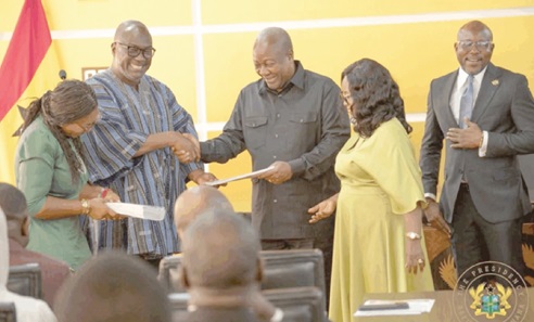 Flashback: Prof. H. Kwasi Prempeh (2nd from left), Chairman, CRC, presenting the report to President John Dramani Mahama