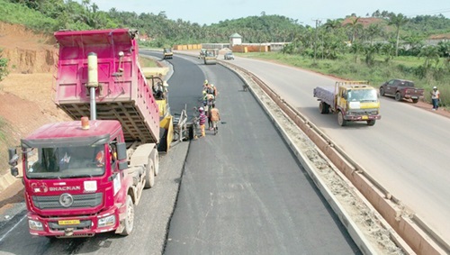 Workers of Justmoh Construction Ltd working on the Takoradi-Agona Junction road