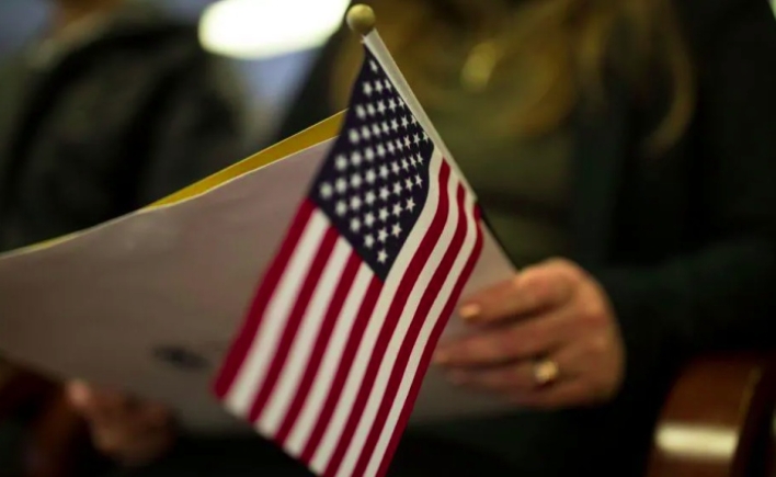 US tells foreigners seeking green cards: Return to your countries to apply