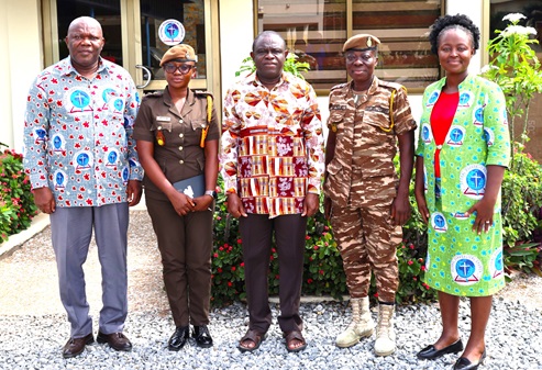 Rt Rev. Prosper Samuel Dzomeku (middle), Moderator of GEC, Rev. Dr Yohanes Kwasi Ahiabu (left), Synod Clerk, Gifty Tayvia Agordome (right) with the Prison officers after the meeting