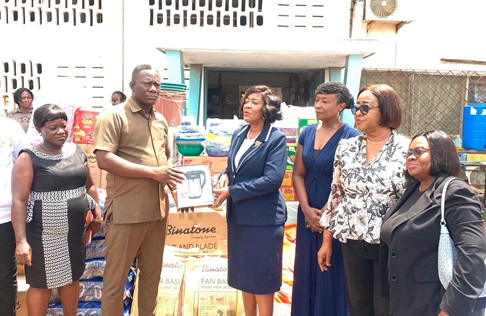 Efua Ghartey (4th from right), President of the GBA, presenting the items to Dr Yennusom Maalug, Medical Director of the Pantang Hospital. Looking on is Sheila Minkah-Premo (2nd from right), President of the Women Forum, GBA