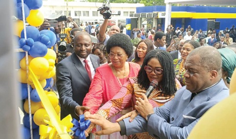 Rev. Stephen Wengam (right), General Superintendent, Assemblies of God, Ghana, being assisted by Dr Agnes Naa Momo Lartey (2nd from right), Minister for Gender, Children and Social Protection; wife of the late Rev. Dr Simon Asore and Rev. Nelson Awentia (left), Greater Accra East Regional Superintendent of Assemblies of God Ghana, to cut the ribbon to open the office complex (Inset)