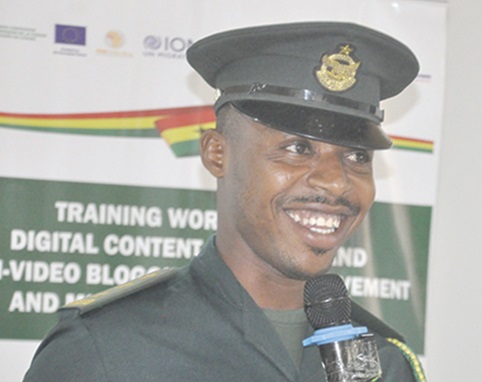 DSI Justice Kudzo Normeshie (inset), Public Affairs Officer, GIS at Aflao, speaking to a section of the participants