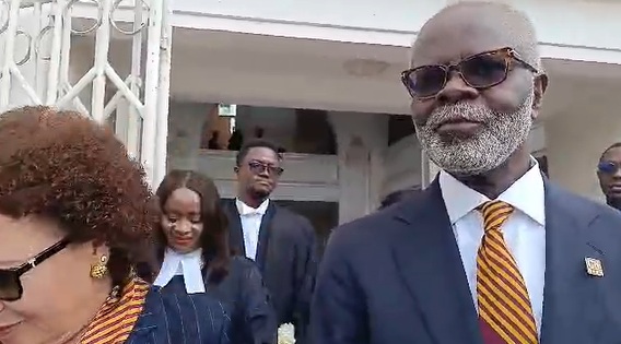 Dr Papa Kwesi Ndoum on wife in court on Thursday morning