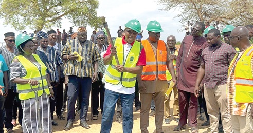 Dr Clement Abas Apaak (with pickaxe), NDC MP for Builsa South, cutting the sod for the construction of the 24-Hour Economy Market