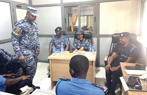 Veronica Deh (seated middle) in a meeting with staff of the GRA