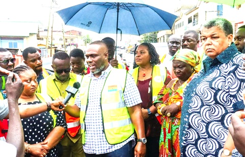 Kenneth Gilbert Adjei (middle), Minister of Works, Housing, and Water Resources, speaking to the media during the visit. With him are Gizella Tetteh-Agbotui (right), his deputy, and Theresa Lardi Awuni (left), MP for Okaikwei North Constituency 
