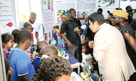 Mehmet Akmermer (2nd from right), Managing Director of Galaxy International School, and Okyeame Kwame inspecting some of the projects