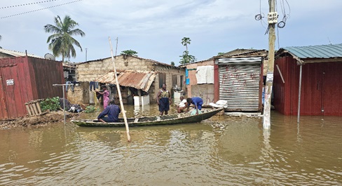 Residents of Tetegu have resorted to the use of canoe within the community. Picture: DOUGLAS ANANE-FRIMPONG