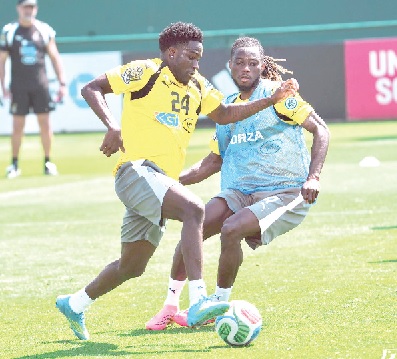 Gideon Mensah (right) training with teammate Ernest Nuamah at the team’s Cardiff base