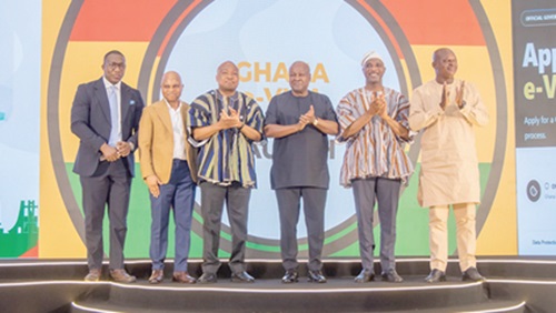 President John Dramani Mahama (3rd from right), with Ministers of Foreign Affairs, The Interior and Transport as well as managers of the e-Visa platform after the launch