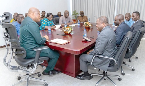 Samuel Okudzeto Ablakwa (left), Minister of Foreign Affairs, and Rev. Dr Stephen Wengam (right), General Superintendent of the Assemblies of God, Ghana, in a chat while their team members look on