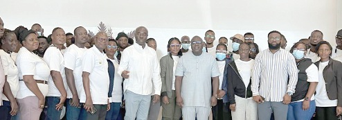 Dr Julius Debrah (arrowed), Chief of Staff, Emmanuel Kwadwo Agyekum (left to the Chief of Staff), Minister of Labour, Jobs and Employment; other officials, and some of the beneficiaries of the programme