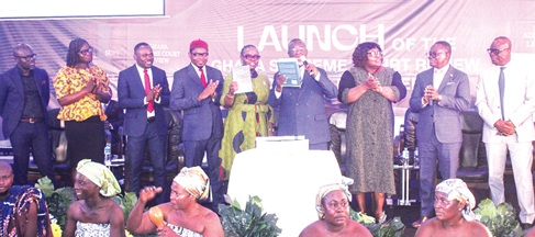 Chief Justice Baffoe-Bonnie (4th from right) and Prof. Nana Aba Appiah Amfo (5th from right), Vice Chancellor, UG, launching the books. Applauding are Prof. Peter Atudiwe Atupare (4th from left), Dean, UG School of Law; Prof. Henrietta Mensah Bonsu (3rd from right), Supreme Court Justice; Justice Yoni Kulendi (2nd from right), Supreme Court Justice, and other dignitaries. Picture: ERNEST KODZI