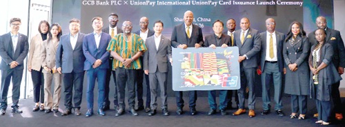 Prof. Joshua Alabi (middle), Board Chairman, GCB Bank; Farihan Alhassan (5th from right), MD, GCB Bank; Feng Chen, General Manager of UnionPay Africa, and teams from both banks