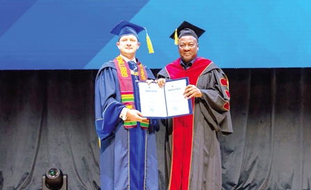 President John Dramani Mahama (right), with his honorary doctorate from the Peoples' Friendship University of Russia (RUDN) in Moscow