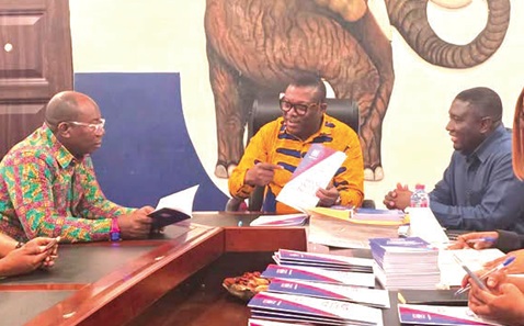 Frederick Opare-Ansah — Chairman, National Officers Elections Committee, NPP, conferring with some members of the committee