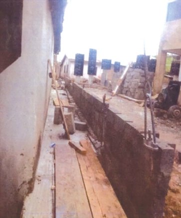 A wall erected on a gutter A wall erected on a gutter