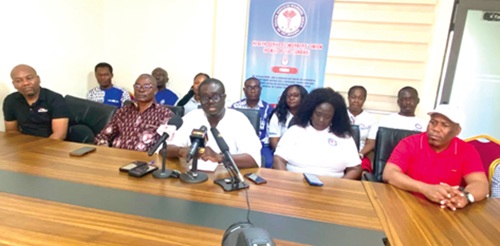Franklin Owusu Ansah, General Secretary of HSWU, with other executives and members addressing the media