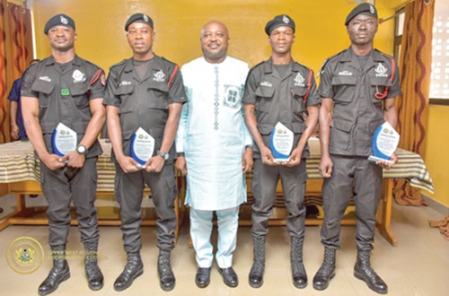 Charles Lwanga Puozing (middle), Upper West Regional Minister,with the honoured officers