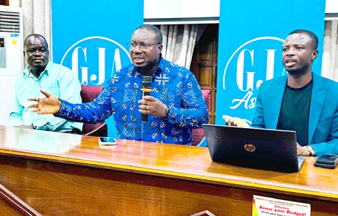 Yaw Adu Domfeh (middle), Ashanti Regional Chairman, GJA, speaking at the launch of the awards  in Kumasi. Flanking him are Nicolas Osei-Wusu (left), Regional Vice Chairman, and Isaac Justice Bediako, Chairman, Awards Planning Committee