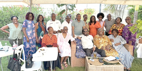 Cameron Duodu (arrowed), surrounded by guests at his 89th birthday celebration