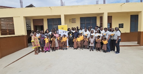 Employees of GCB and pupils of the Oblogo M/A Basic School