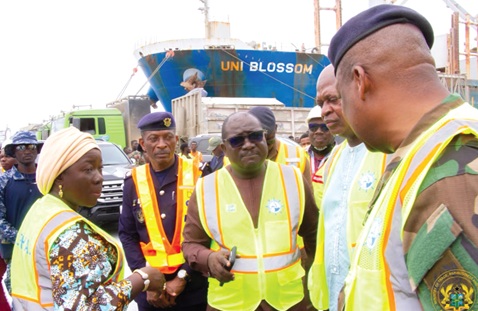 Elizabeth Ofosu-Agyare (left), Minister of Trade, Agribusiness and Industry; Tebon Zumah (3rd from left), Director of Tema Port; Joseph Bukari Nikpe (2nd from right), Minister of Transport, and Major General Paul Seidu Tanye-Kulono (right), Director-General of the Ghana Ports and Harbours Authority, in a chat during a visit to the port last Friday