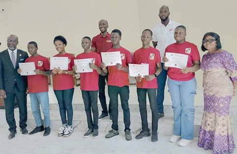 Rt. Rev. Dr Hilliard Dela K. Dogbe, Chairman of the Board of Trustees, with beneficiaries of the Miafe Fiawo Scholarship