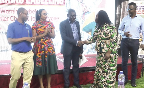 Harriet Nuamah Agyemang (2nd from right), Country Director of SEND Ghana, exchanging pleasantries with Dr Hafiz Adam Taher (3rd from right), the Director of Technical Coordination at the Ministry of Health, after the launch of the Mass Media Campaign on Front-of-Pack Warning Labelling. With them are other dignitaries. Picture: EDNA SALVO KOTEY