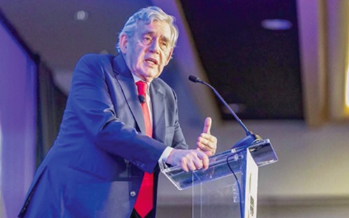 Gordon Brown (left), Former British Prime Minister, addressing the audience