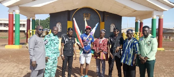 King Klottey (4th from left) with authorities at the Burkina Faso-Paga border where he began the journey