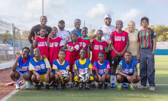 Kofi Sarkodie (arrowed) and Amy Griffin (2nd right, top row) and some of the participating girls and coaches in a group photo