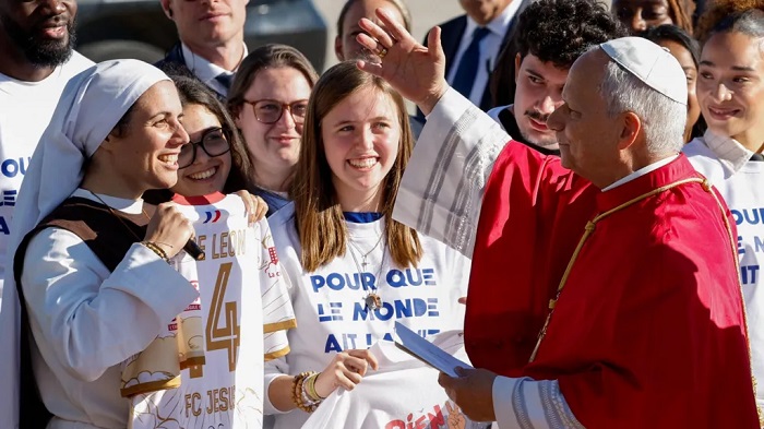 The pontiff greeted crowds waiting for him on the tarmac at Orly airport