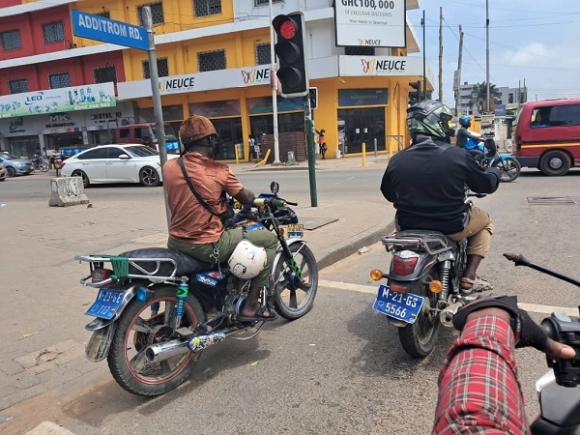 This Okada rider failed to wear a crash helmet, although he has one.