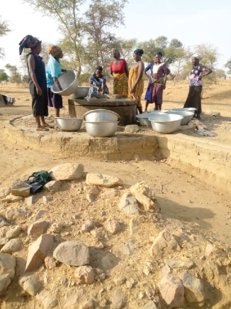 Some women gathered around a well in the community to fetch water Some women gathered around a well in the community to fetch water