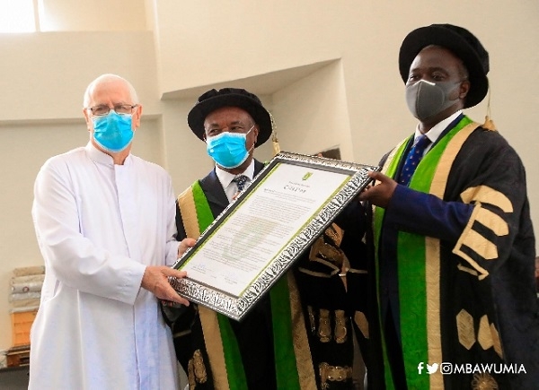Fr. Andrew Campbell receiving an award
