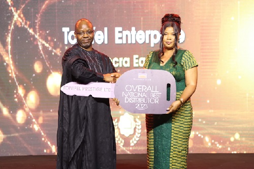 Managing Director, Mr. Festus Tettey, presents car prize to Overall National Best Distributor to Tonifel Prestige Limited.