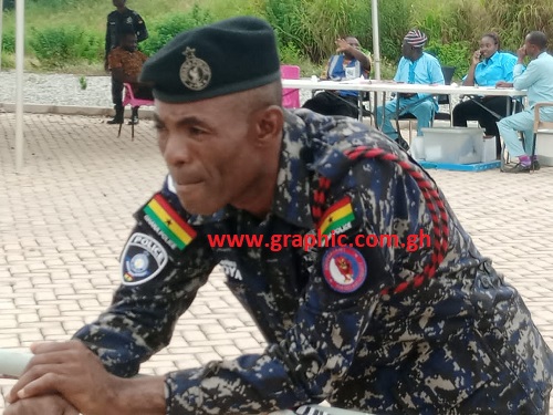 A police officer keeping an eye on the voting process