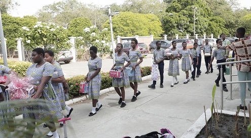 The students holding their gifts