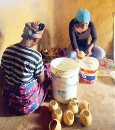 •Our reporter, Ms Gloria Apprey tries her hands on shea butter packaging 