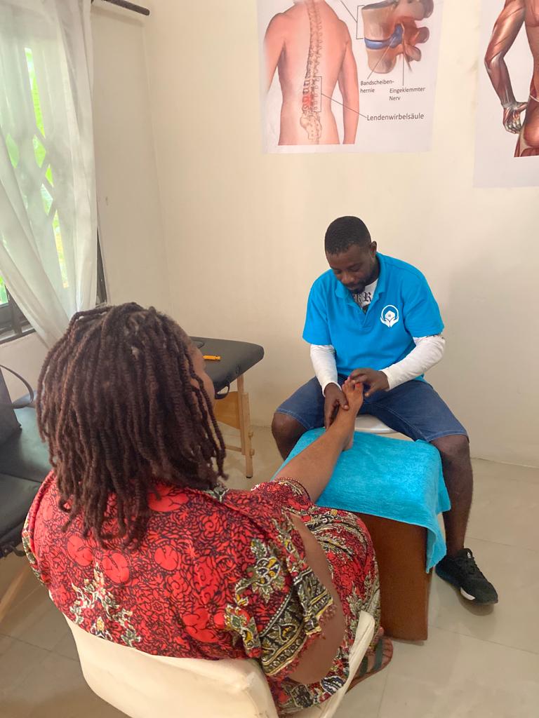 Mr Charles Ntisem, an Acupressure therapist of Kaiser Reha Physiotherapy and Massage Centre working on a client Mr Charles Ntisem, an Acupressure therapist of Kaiser Reha Physiotherapy and Massage Centre working on a client