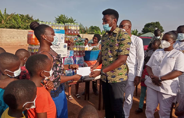 The son of Rev. Adjei also presenting some cash amount to celebrate his birthday The son of Rev. Adjei also presenting some cash amount to celebrate his birthday
