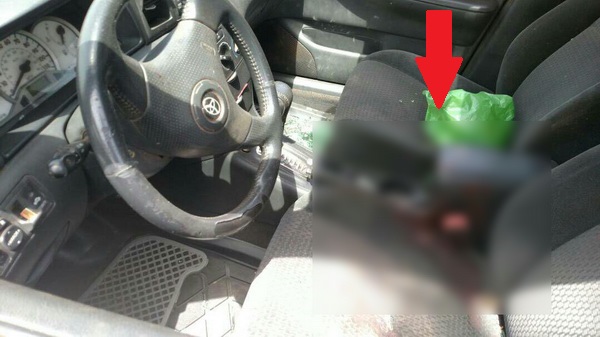 Arrowed: The blood-stained seat of the Toyota Corolla