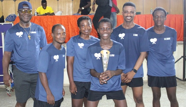 The True Hustler Loopers team in a group photograph with their trophy.